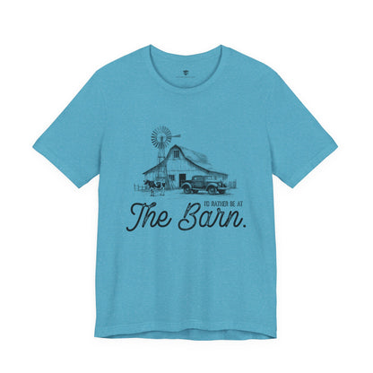 Blue t-shirt with a graphic of a barn and truck, and text 'I'd Rather be at The Barn'
