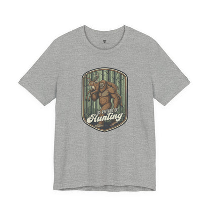 Gray t-shirt with a graphic of Big Foot and text 'I'd Rather Be Hunting' 