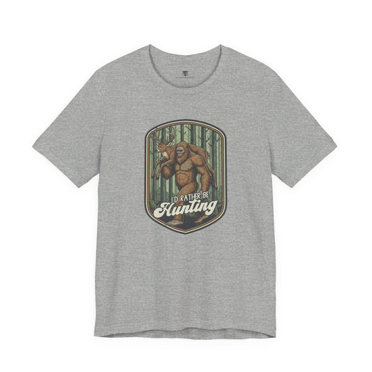 Gray t-shirt with a graphic of Big Foot and text 'I'd Rather Be Hunting' 