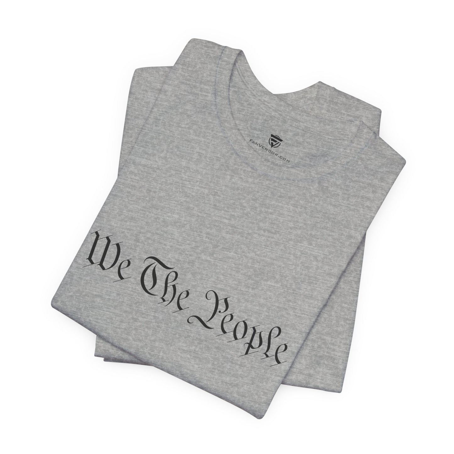 Gray t-shirt with 'We The People' printed on it, folded and displayed against a white background