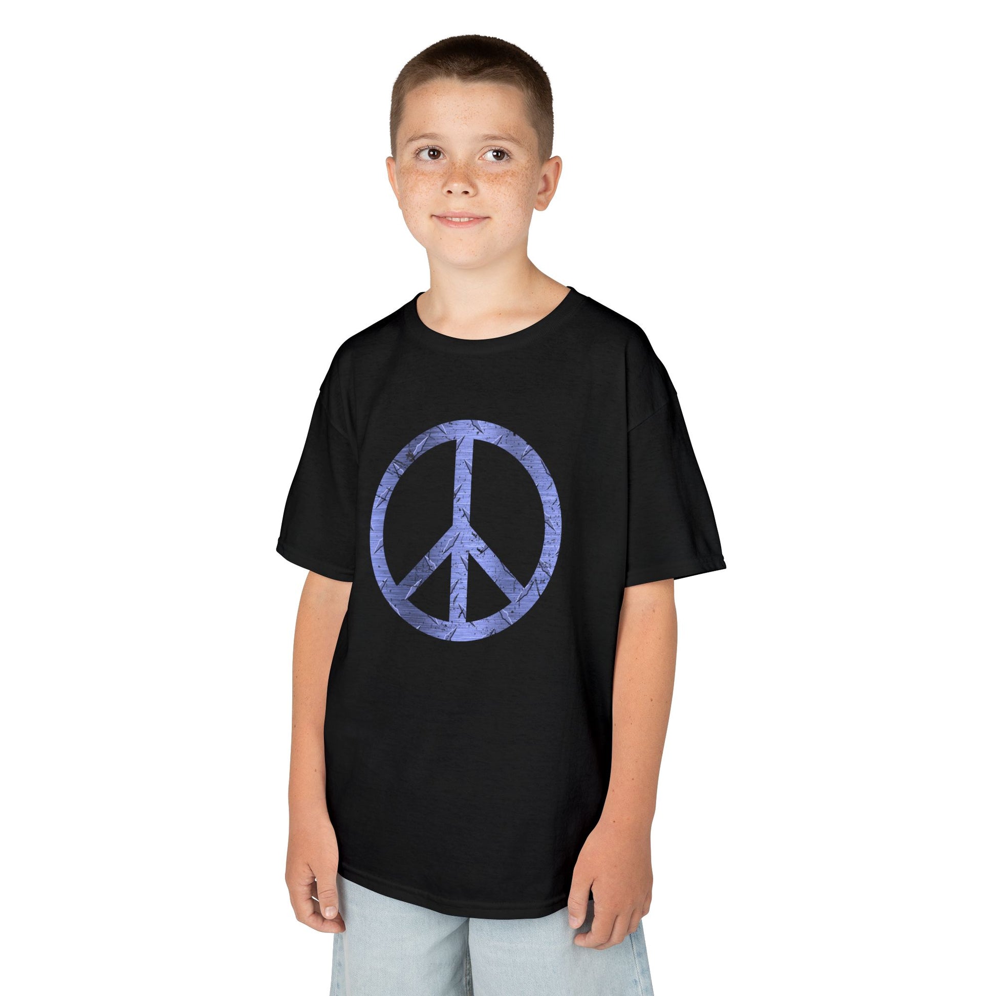 Child wearing a black t-shirt with graphic designs on a white background