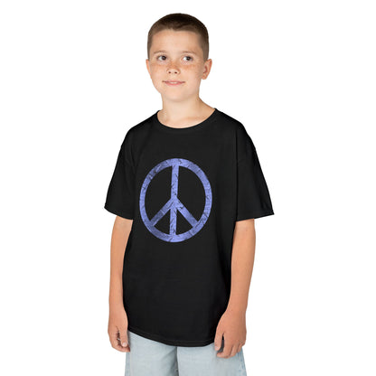 Child wearing a black t-shirt with graphic designs on a white background