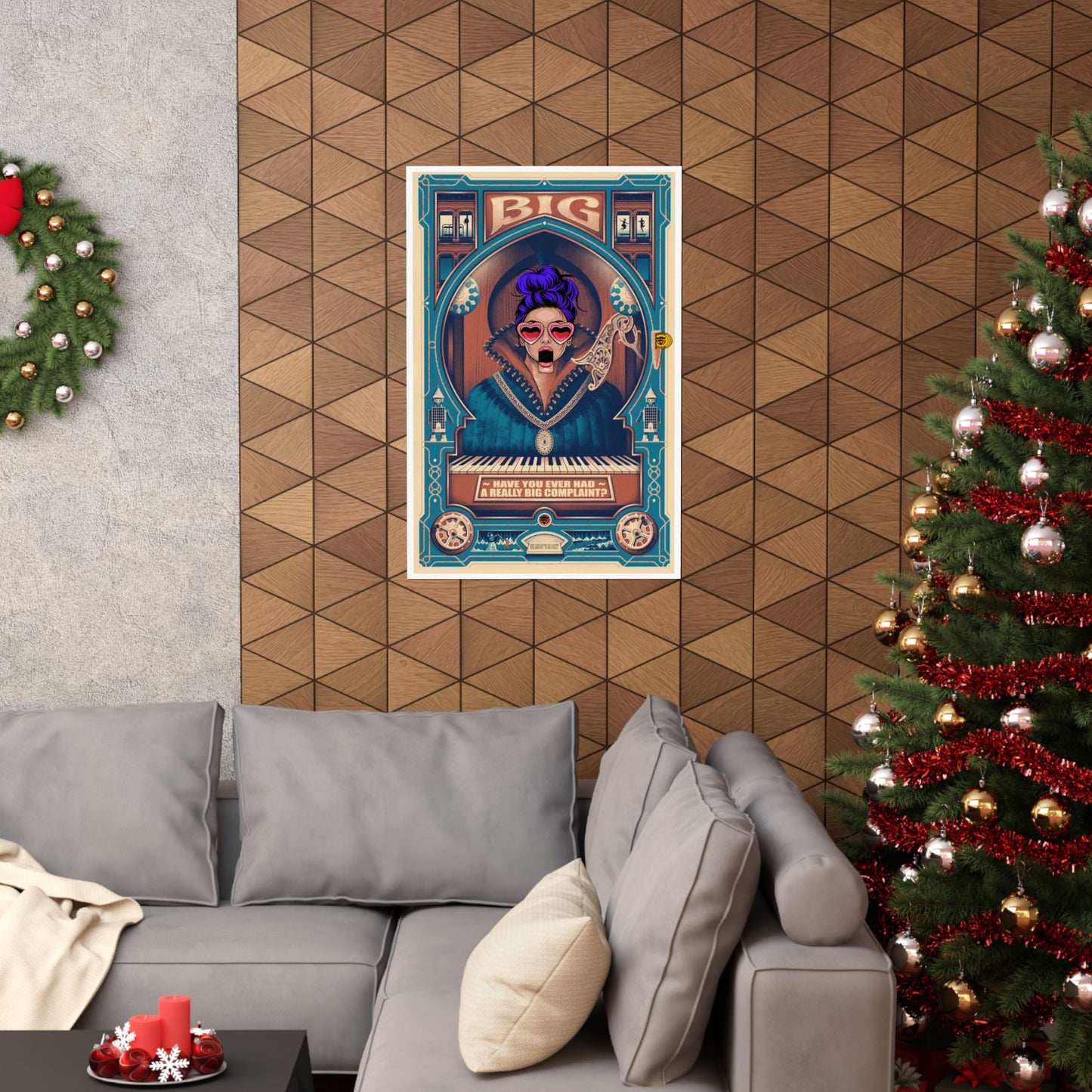 Poster of a woman with purple hair and a keyboard on a wall above a gray sofa with a Christmas tree to the right.