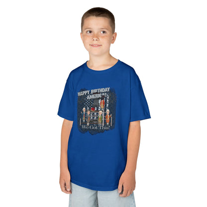 Child wearing a blue t-shirt with a graphic design on a white background