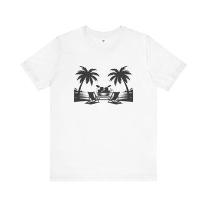 White t-shirt with black palm tree and beach chair graphic on a white background