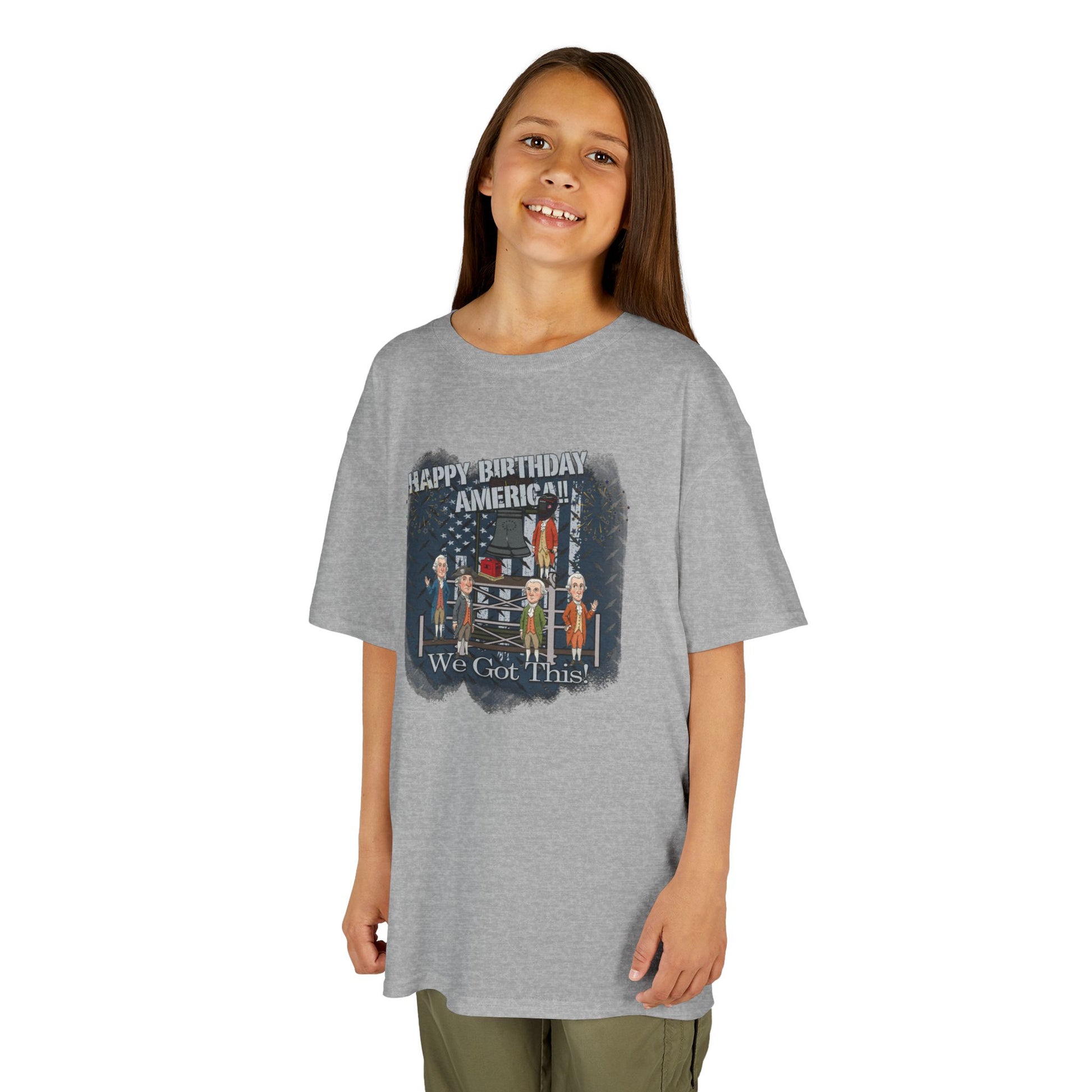 Girl wearing a gray t-shirt with a graphic design on a white background