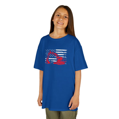 Child wearing a blue t-shirt with a graphic design on a white background