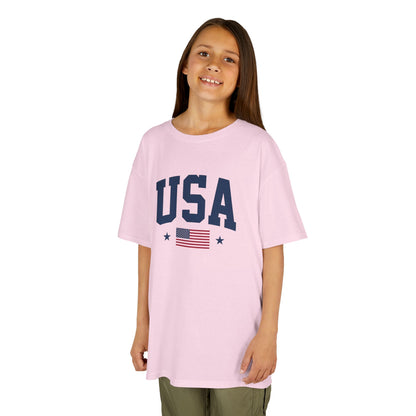 Young girl wearing a pink 'USA' t-shirt with an American flag on a white background