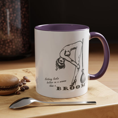 Mug with a humorous design and text on a wooden surface with coffee beans and a spoon.