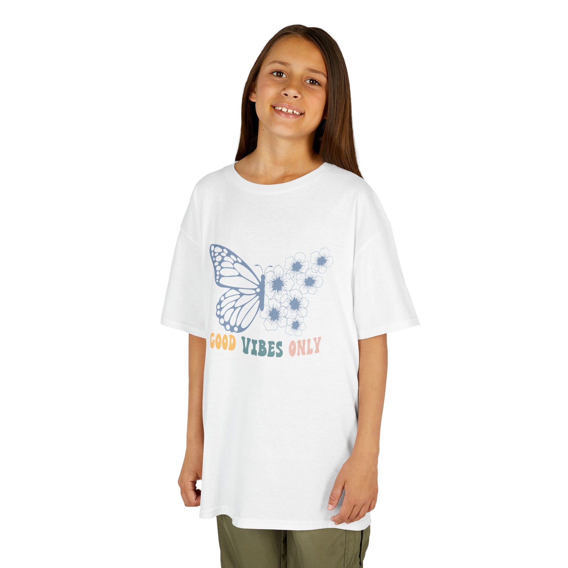 Young girl wearing a white t-shirt with a butterfly graphic and text on a white background