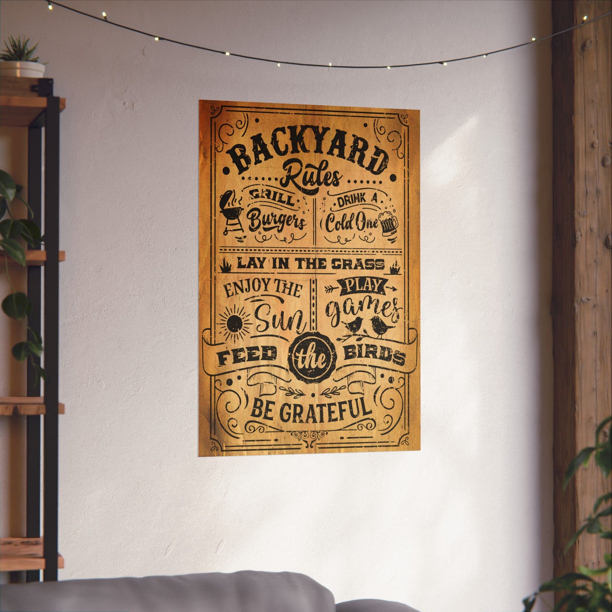Poster with 'Backyard Rules' text on a wall in a room with plants and a shelf.