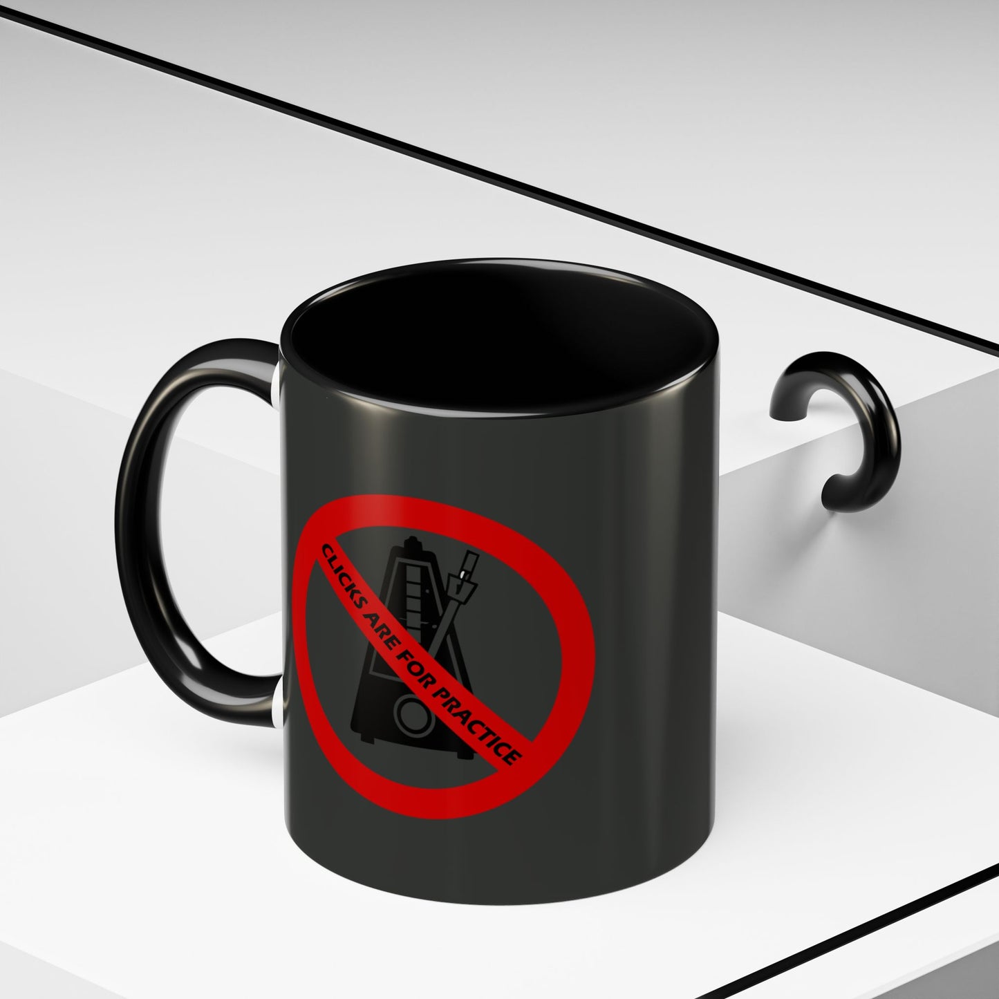 Black mug with a red prohibition sign and text on a white background