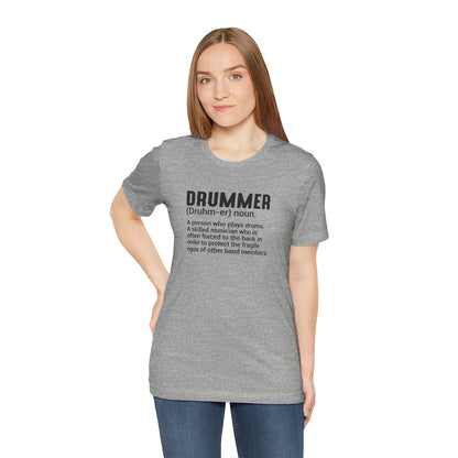 Woman wearing a gray t-shirt with 'DRUMMER' definition text on a white background