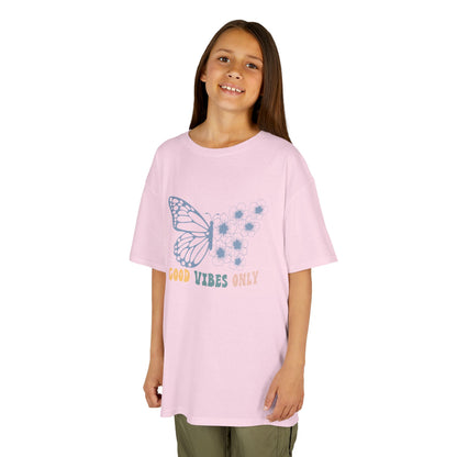 Young girl wearing a pink t-shirt with a butterfly design and text on a white background