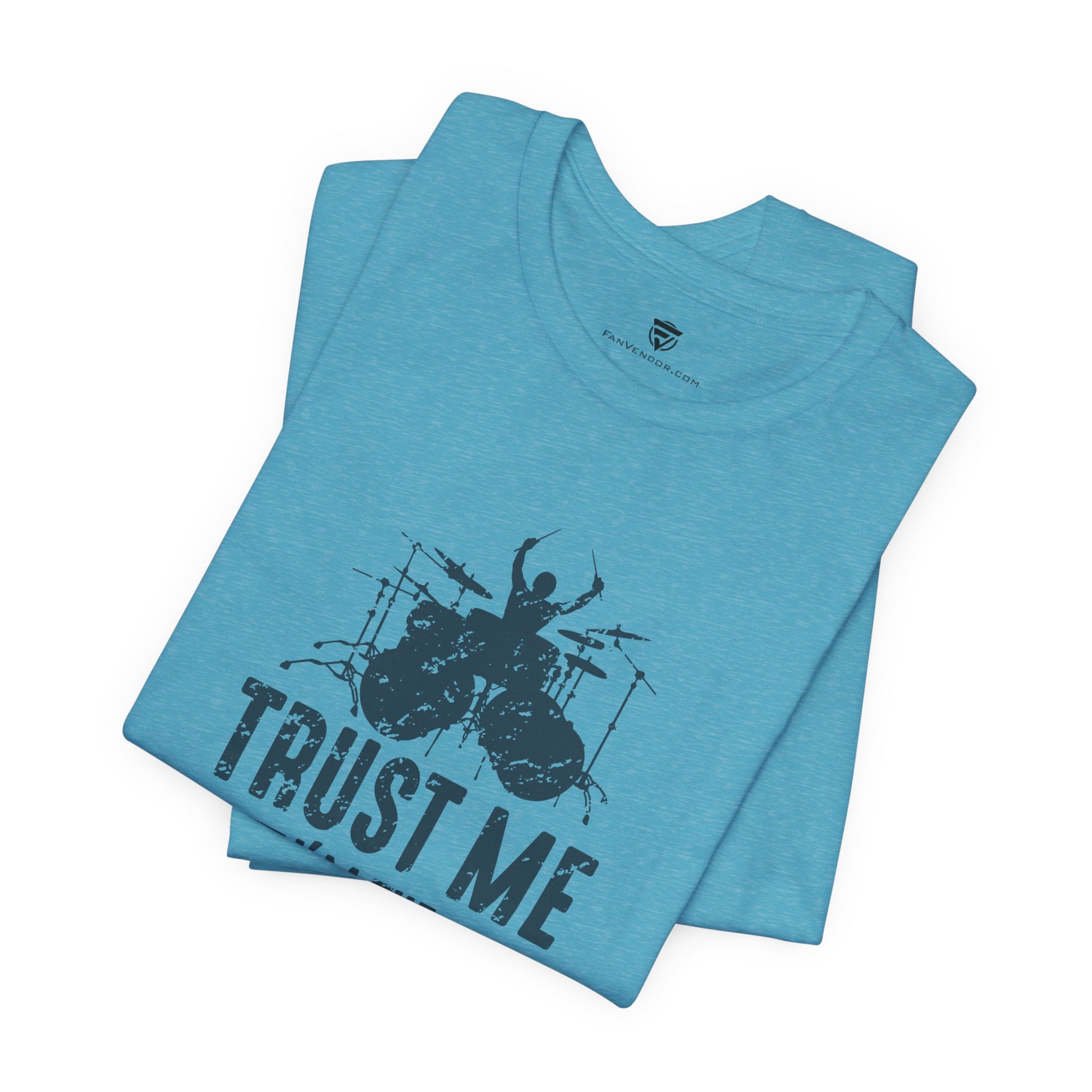 Folded blue t-shirt with black graphic and 'Trust Me' text 