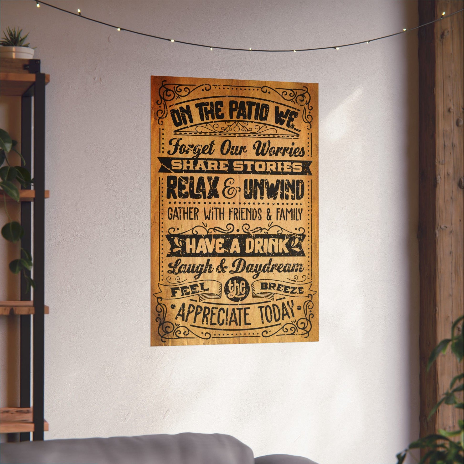 Decorative wall poster with motivational text on a white wall in a home setting.