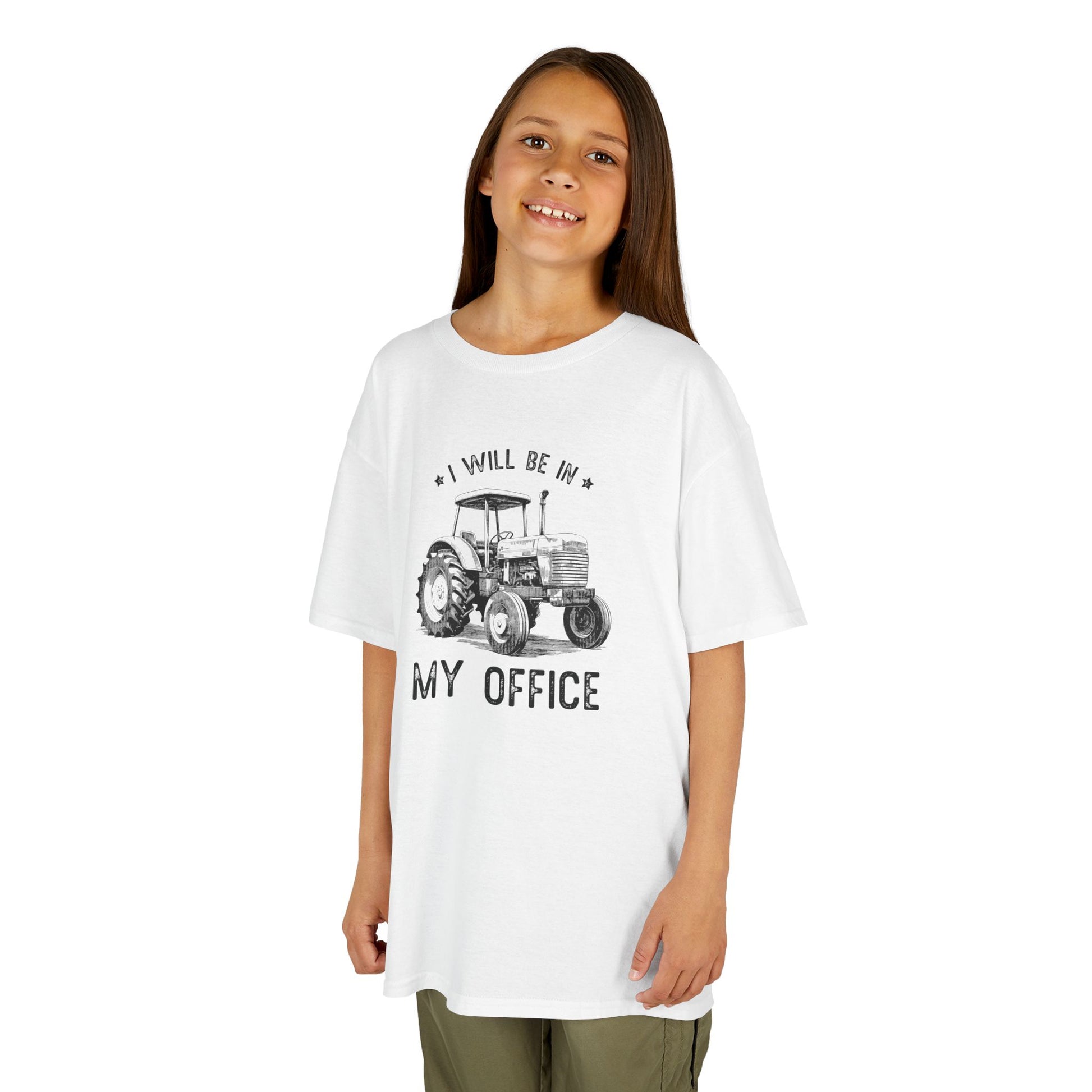Young girl wearing a white t-shirt with a tractor graphic and text on a white background