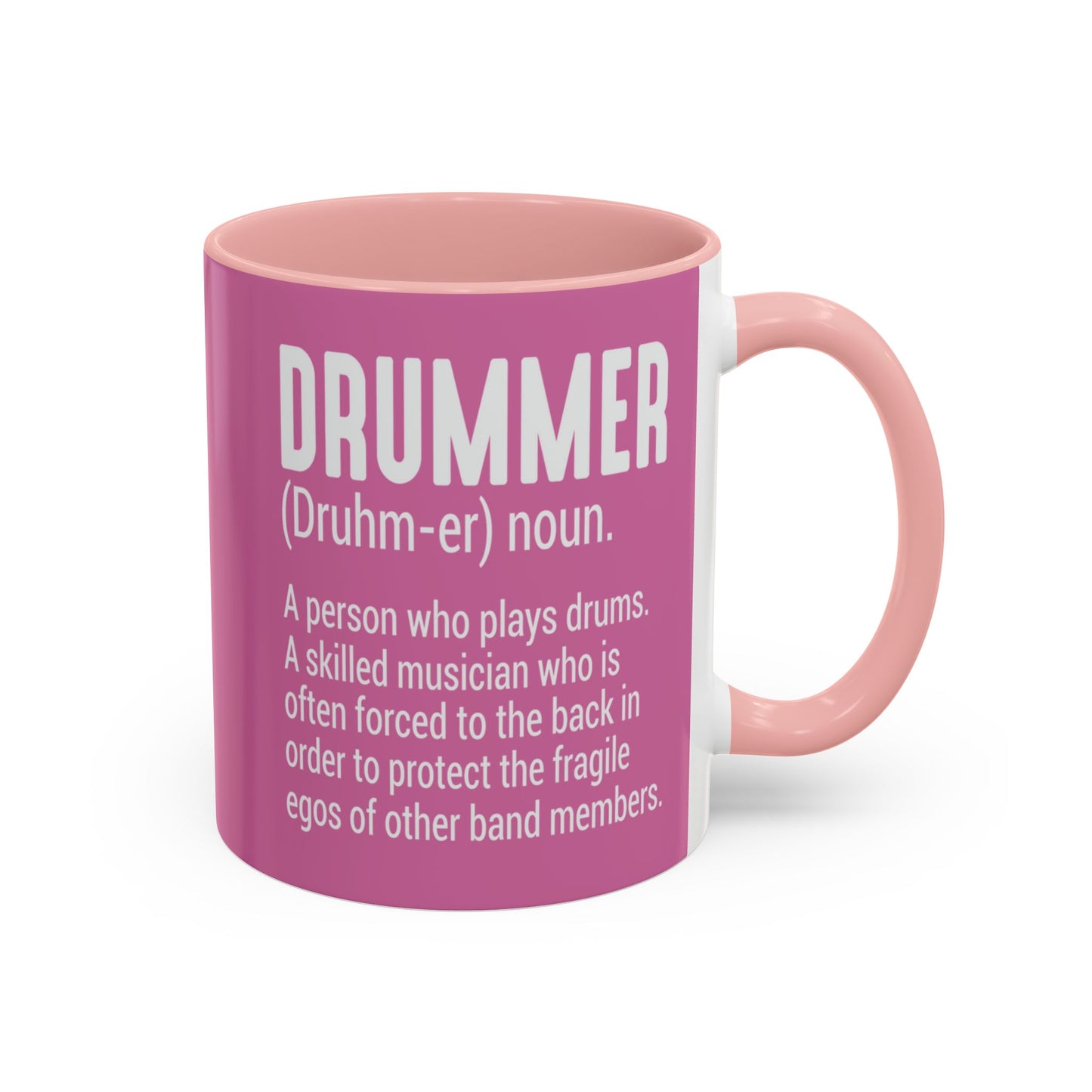 Pink mug with text definition of a drummer on a white background