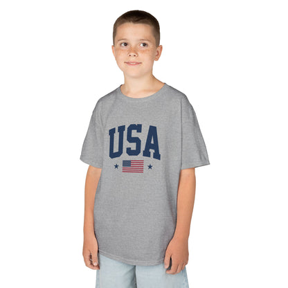 Child wearing a gray t-shirt with 'USA' and an American flag design on a white background