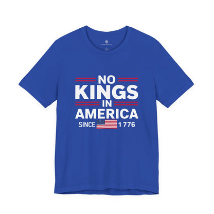 Blue t-shirt with 'No Kings in America Since 1776' text and American flag on a white background